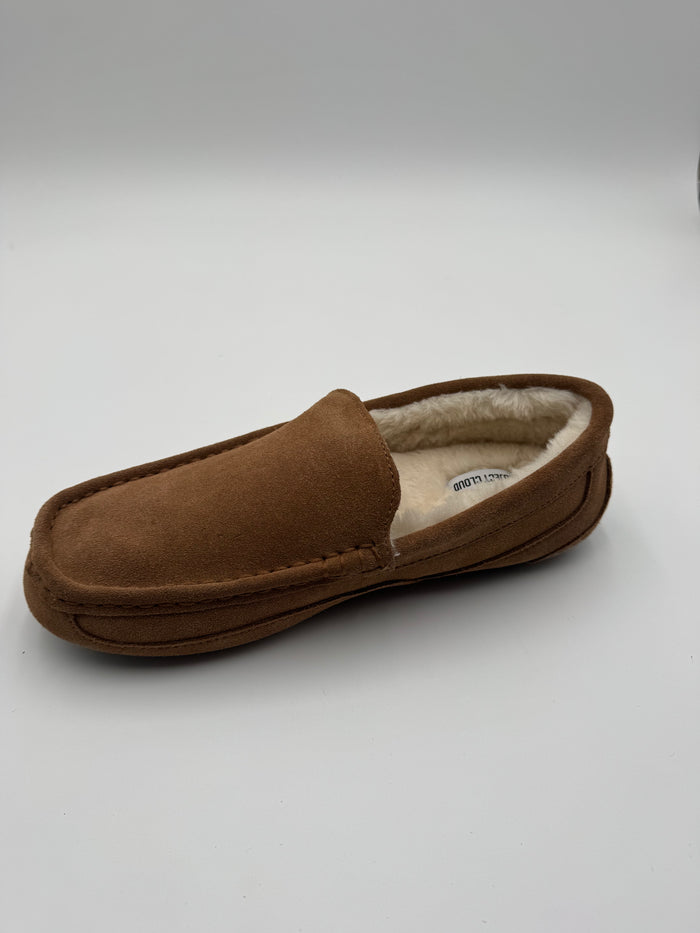A single brown suede slipper with a cream-colored shearling lining, photographed on a light gray studio background.