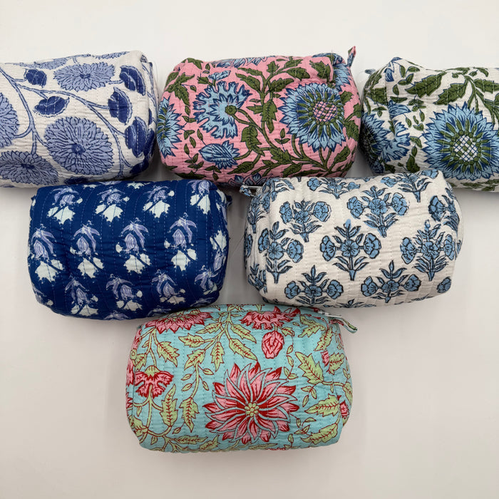 Set of floral-patterned fabric pouches on a white background