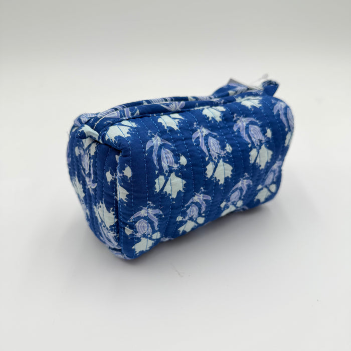 Blue and white patterned fabric pouch on a white background