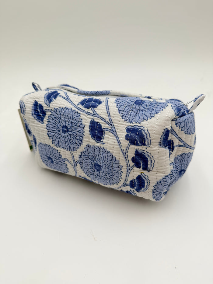 Fabric pouch with blue floral pattern on a white background