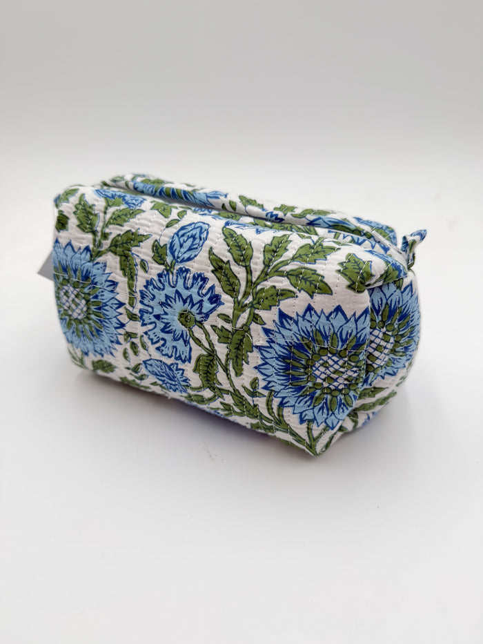 Fabric pouch with blue and green floral pattern on a white background