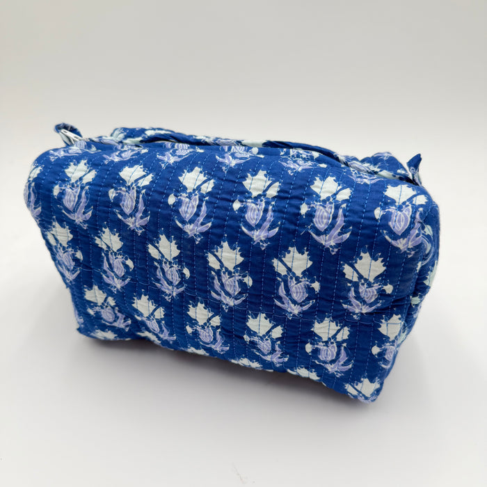 Blue and white patterned fabric bag on a white background