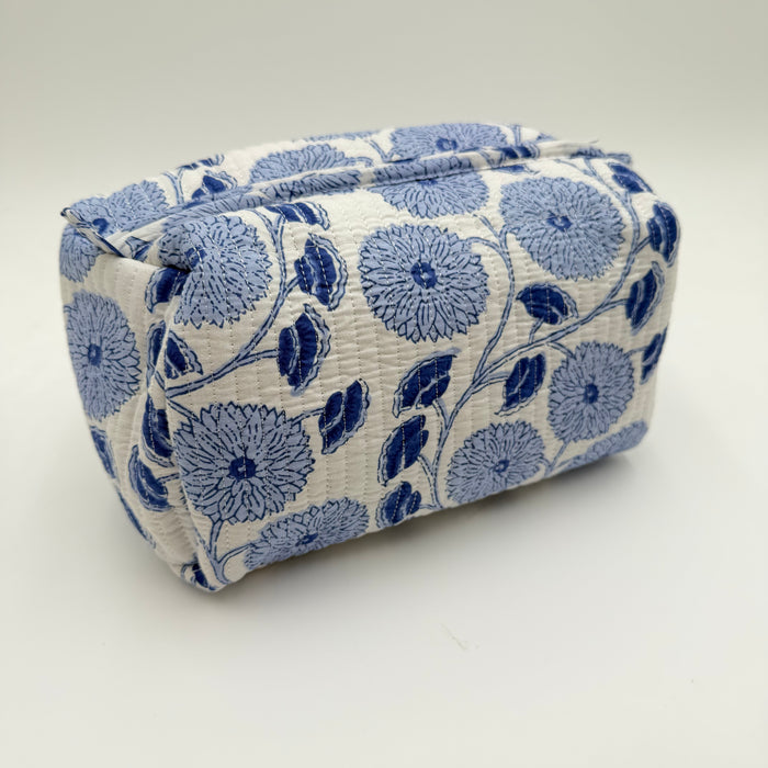 Rectangular fabric pouch with blue floral pattern on a white background
