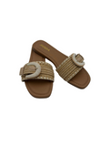Pair of brown sandals with woven straps on a white background