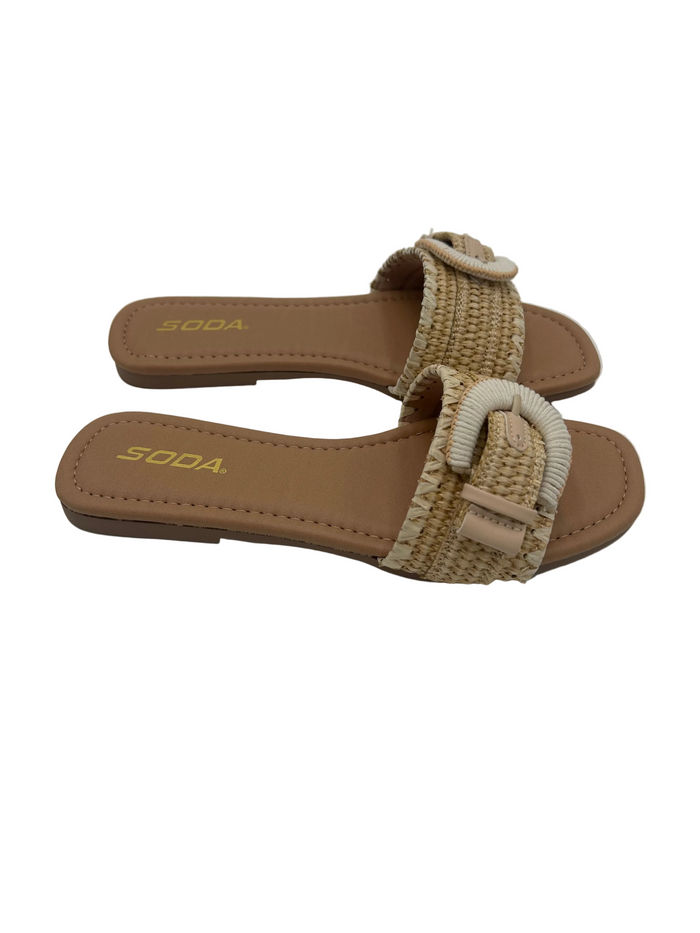 Brown sandals with a bow detail on a white background