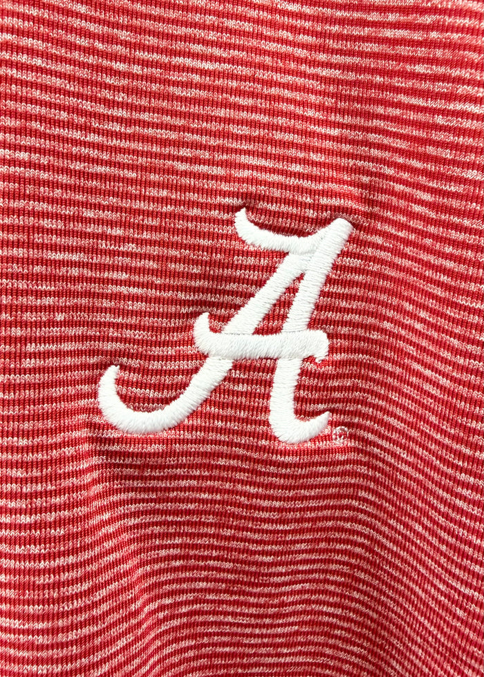 Close-up of a red and white striped knit fabric with a white embroidered script letter A logo.