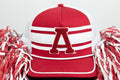 Red and white cap with a large letter 'A' on a white background