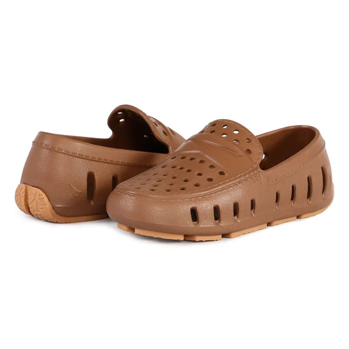 Pair of brown clogs on a white background
