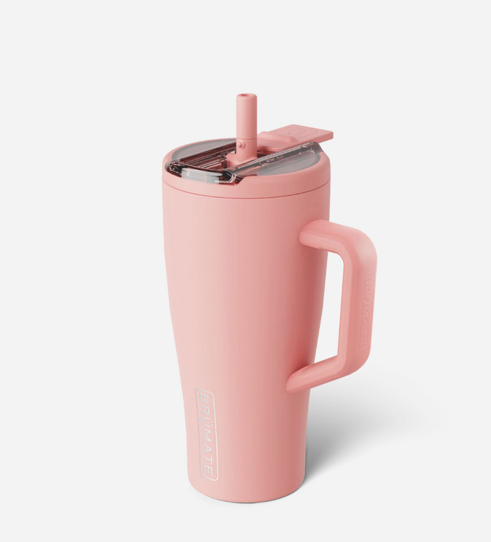 Pink insulated mug with handle and straw lid on a white background