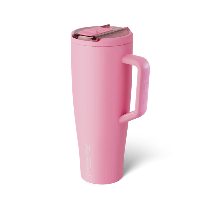 Pink travel mug with a handle on a white background