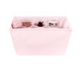Pink fabric organizer with compartments on a white background
