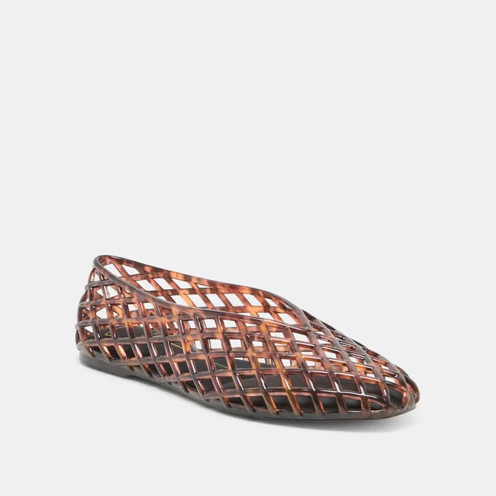 Woven patterned flat shoe on a light gray background