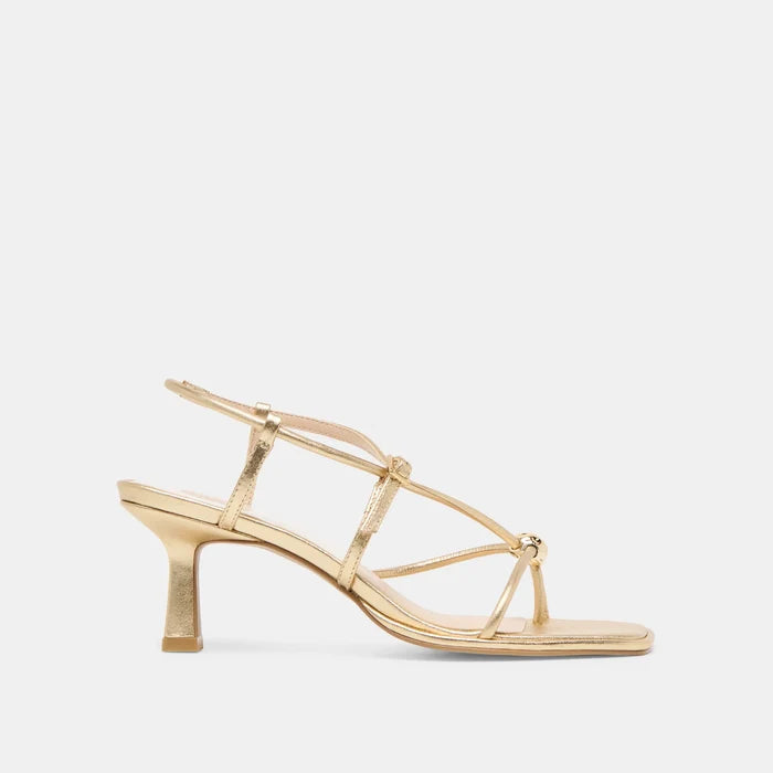 Gold high-heeled sandal on a light gray background