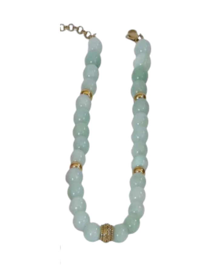 A beaded necklace featuring light green jade-like round beads accented with gold spacer rings and a textured gold center bead, shown on a plain white background.