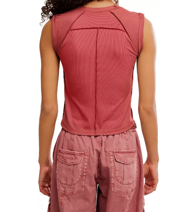 Woman wearing a sleeveless orange top