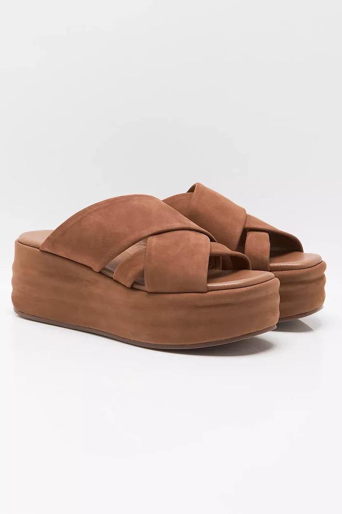 Brown platform sandal on a white background