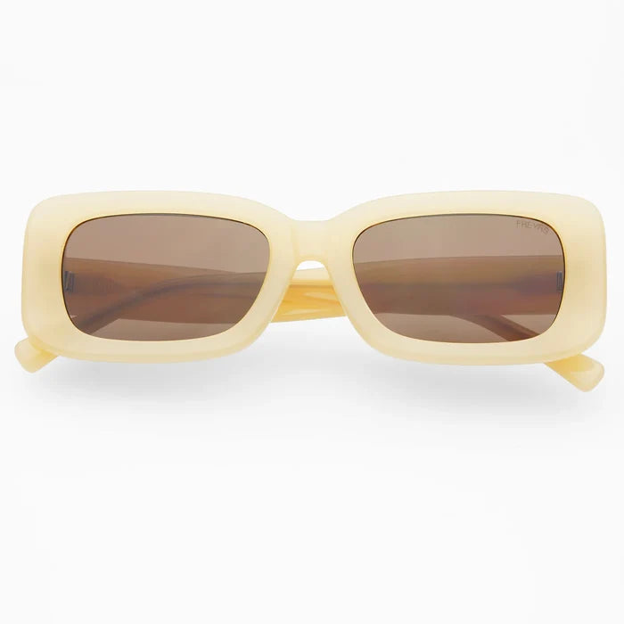 Yellow sunglasses with brown lenses on a white background