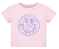 A light pink short-sleeve t-shirt featuring a large circular smiley face graphic on the front. The smiley face has a leopard print pattern in shades of purple, lavender, and pink on a white background, with a glittery pink border.