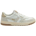 White sneaker with brown sole on a white background