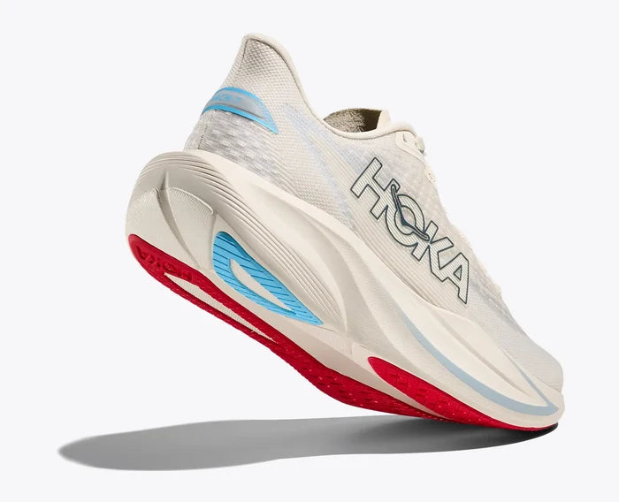 Hoka running shoe with red and blue sole on a white background