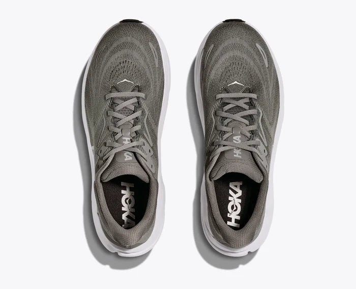 Gray running shoe with white sole on a light gray background