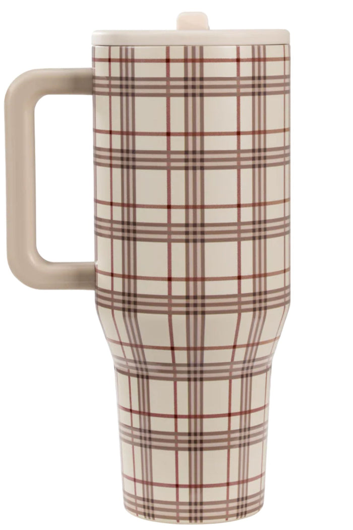 Plaid-patterned travel mug with beige handle on a white background
