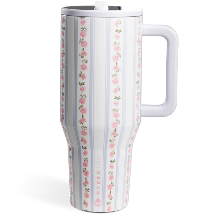 White travel mug with floral pattern on a white background