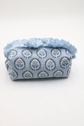 A light blue and white patterned pouch with a ruffled top, photographed on a plain white background.