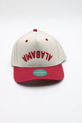 An Alabama Crimson snapback cap featuring an off-white crown with red embroidered 'ALABAMA' text and a red visor, shown on a clean white background.
