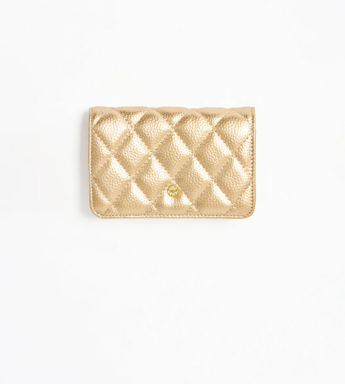 Gold quilted wallet on a white background