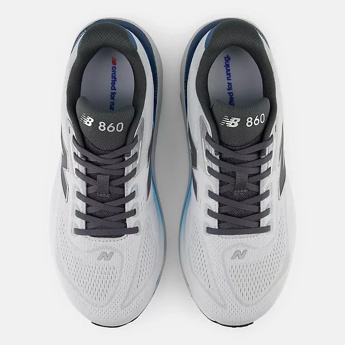 Pair of New Balance 860 running shoes on a white background
