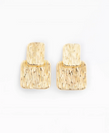 A pair of gold textured drop earrings with a layered, geometric design, photographed on a clean white background.