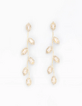 A pair of gold-toned dangle earrings with multiple marquise-cut clear crystals, arranged symmetrically on a plain white background.