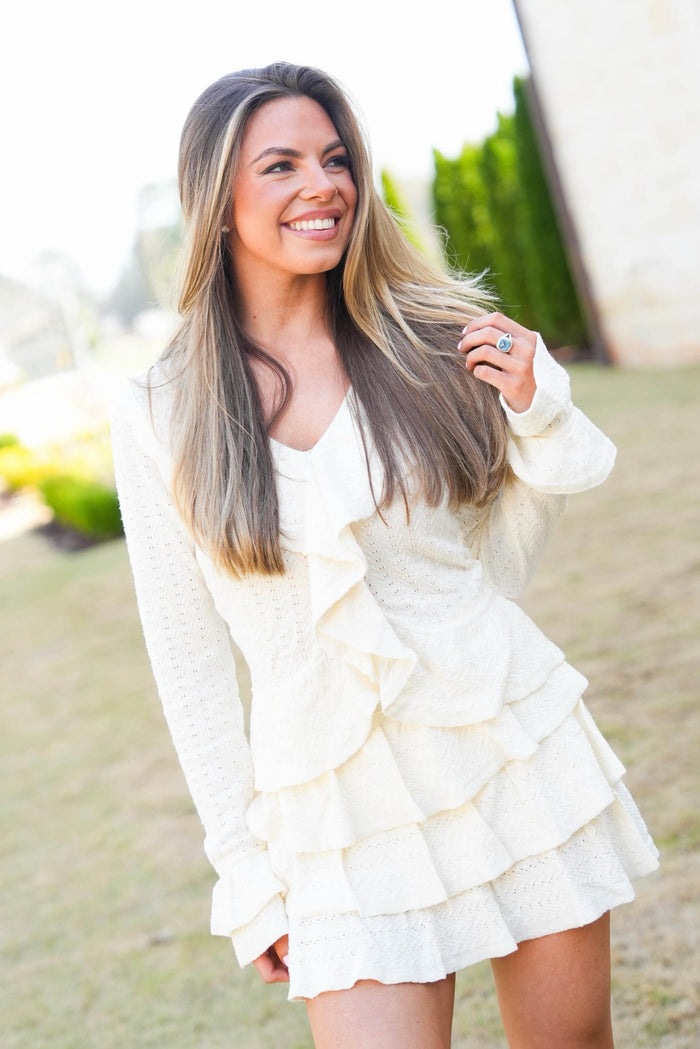 Woman wearing a white ruffled dress outdoors