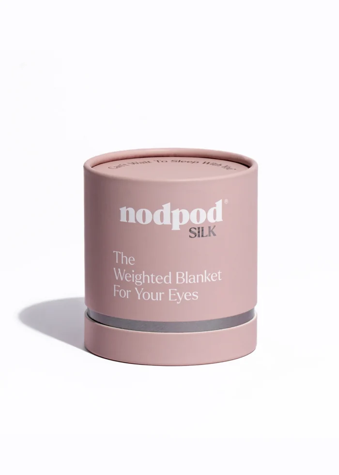 Pink cylindrical container labeled 'nodpod' on a white background