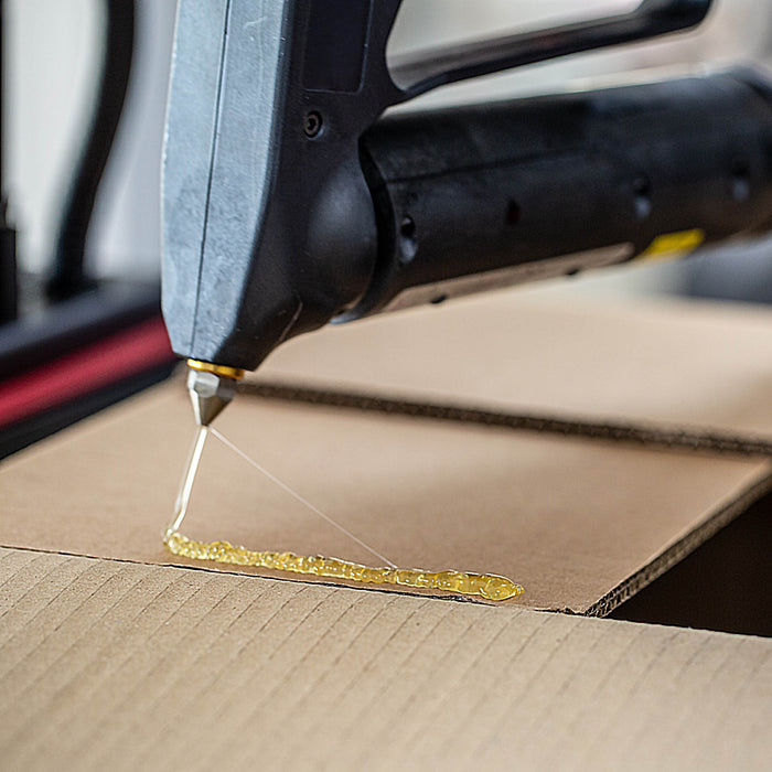 Power Adhesives Tecbond 110B hot melt adhesive applied to corrugated cardboard for fast packaging assembly