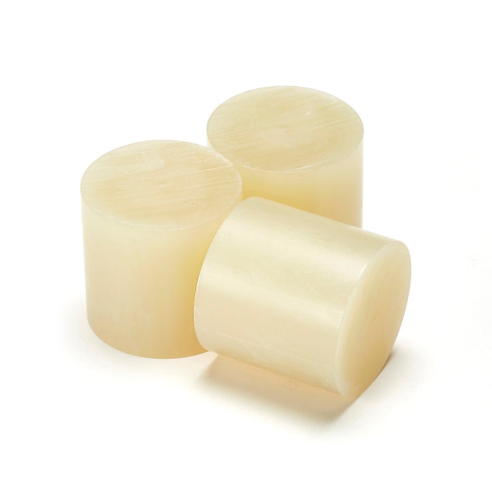 Tecbond 214 series 43mm glue slugs shown in pale amber for paper and board bonding.