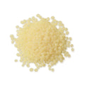 Pile of Pale Amber TEC Bond 214B Hot Melt Pellets