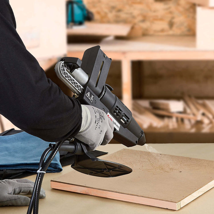 Power Adhesives 7300 hot melt spray gun dispensing adhesive for foam-to-wood bonding applications.