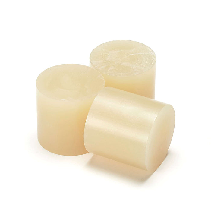 Power Adhesives Tecbond 550 clear 43mm glue slugs shown as solid cylinders for bulk hot melt adhesive use