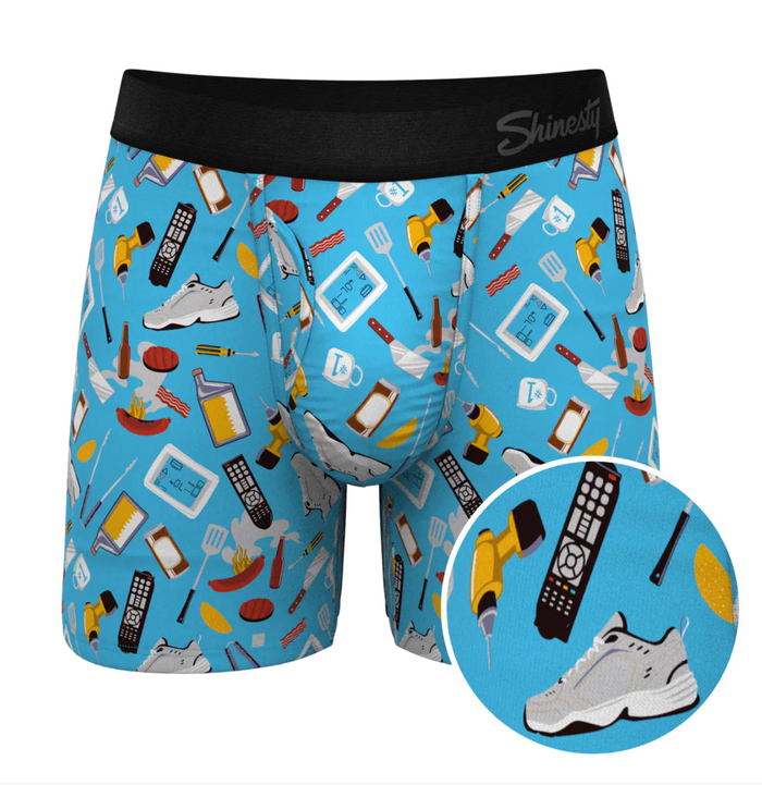 Blue boxer briefs with various patterns and a close-up of a remote control, phone, and shoes on a white background.