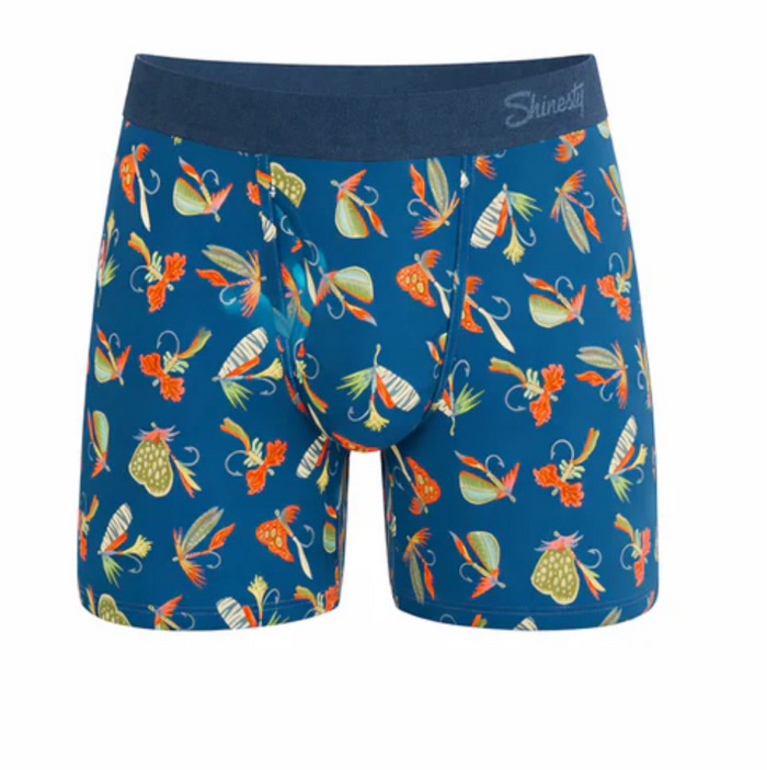 Blue boxer briefs with colorful fishing lure pattern on a white background