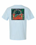 A light blue short-sleeve t-shirt shown from the back, featuring a large graphic print of an orange-red gate with green trees and the text 'Majestic' and 'The Groove'.