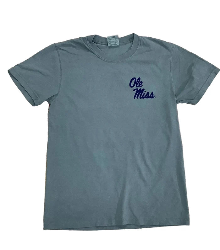 A slate gray short-sleeve t-shirt with 'Ole Miss' printed in navy blue script on the left chest, laid flat on a rustic wooden plank background.