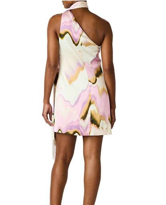 Woman wearing a floral one-shoulder dress on a white background