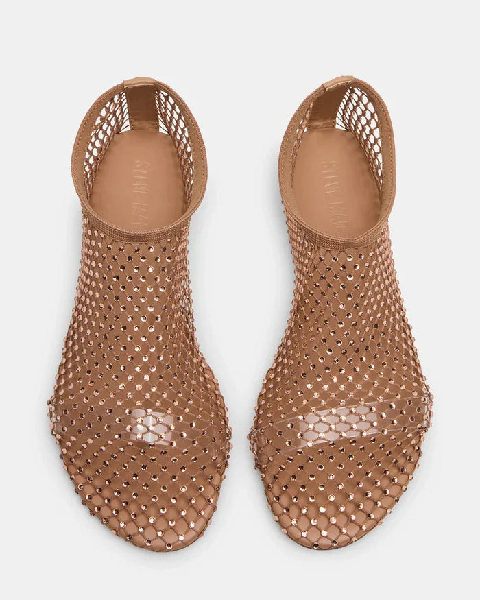 Pair of brown perforated sandals on a white background