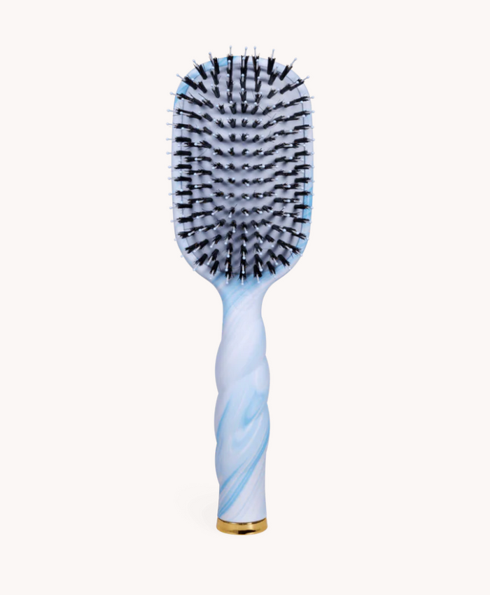 Hairbrush with blue and white handle on a white background