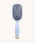 Hairbrush with blue and white handle on a white background