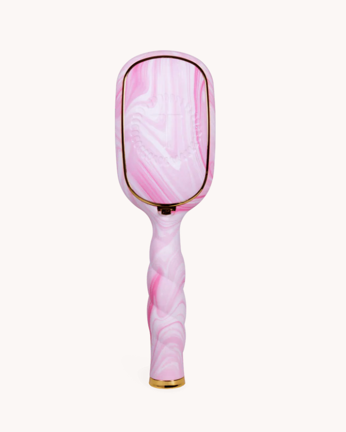 Marble-patterned hairbrush with pink and white design on a white background