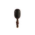 Hairbrush with tortoiseshell handle on a white background
